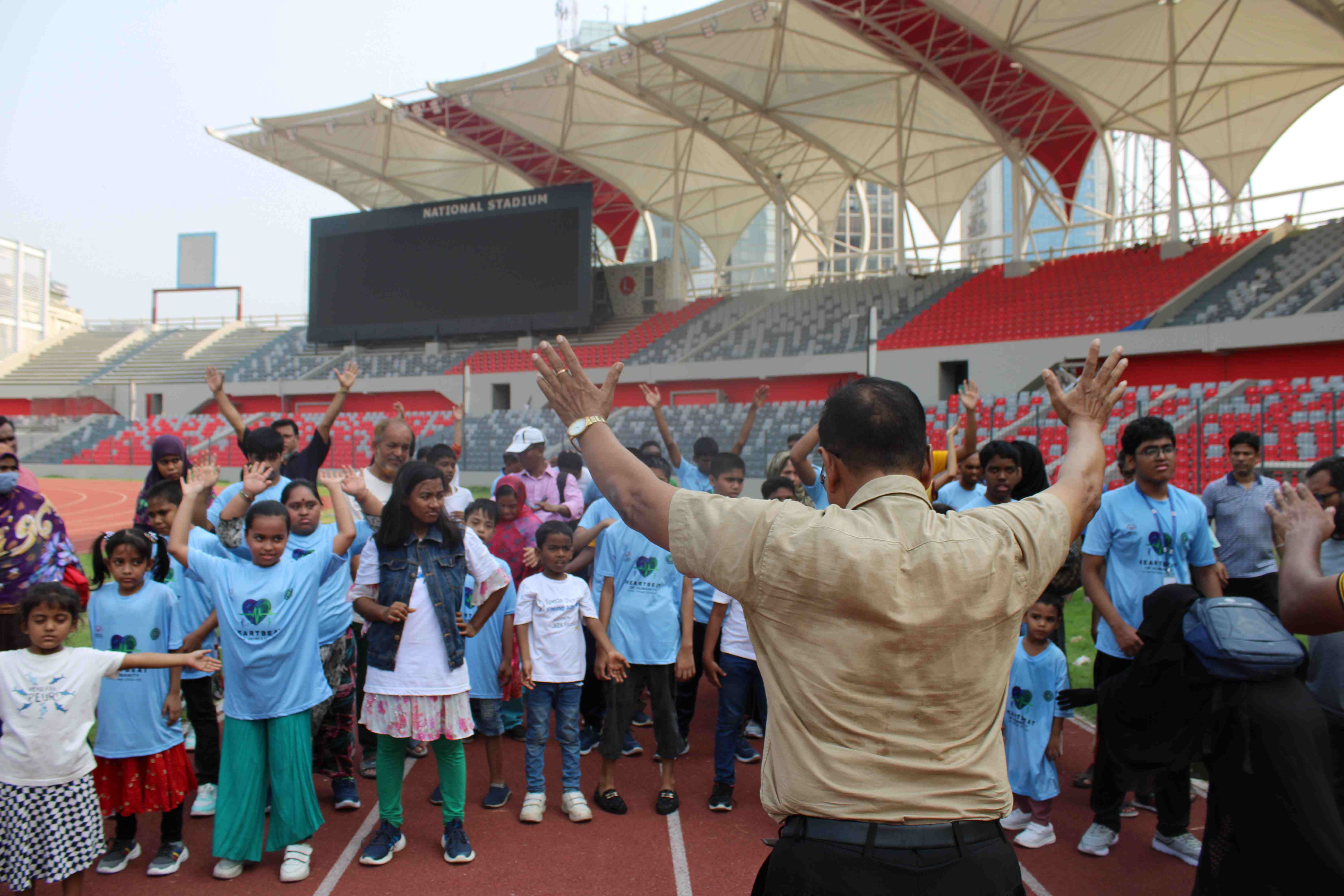 Special Olympics Bangladesh athletes training together on a field